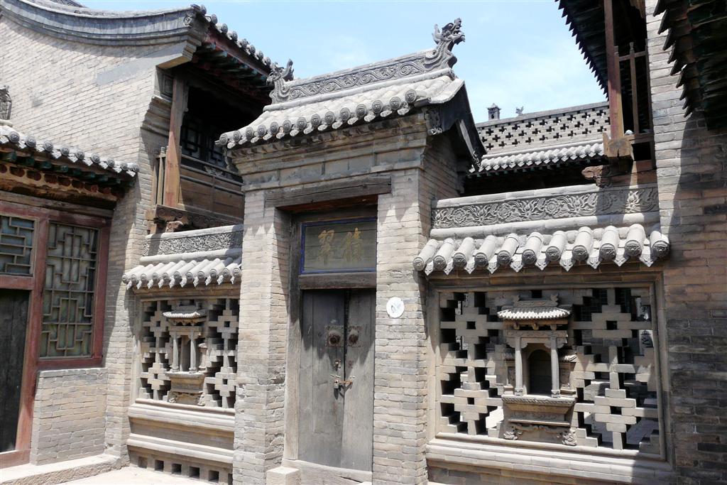 PINGYAO (Wang Family Courtyard)- afscheidingsmuur op een binnenplaats